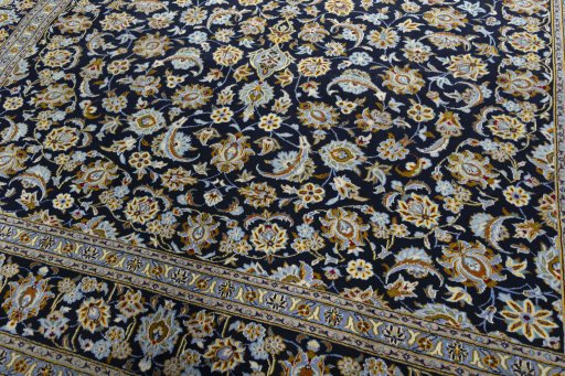 Close-up detail of 2000s Kashan rug from Iran / Persia showing Wool weave