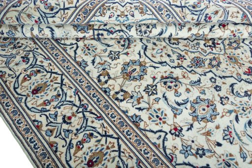 Close-up detail of 2000s Kashan rug from Iran / Persia showing Wool weave