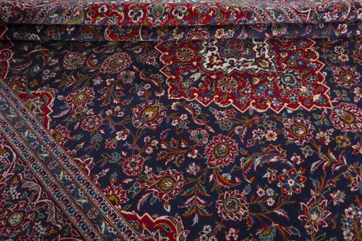 Close-up detail of 2000s Kashan rug from Iran / Persia showing Wool weave