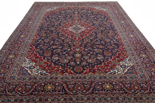 Surface texture of 2000s Kashan rug with natural Wool and intricate pattern