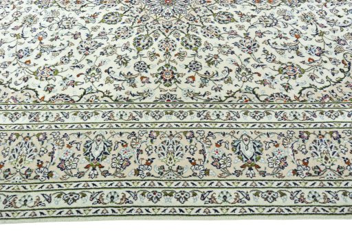 Corner detail of 2000s Kashan rug showing border pattern and Wool pile