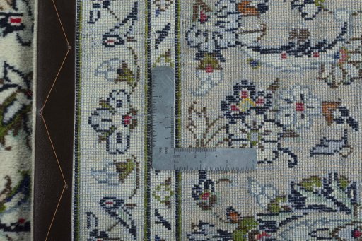 Surface texture of 2000s Kashan rug with natural Wool and intricate pattern