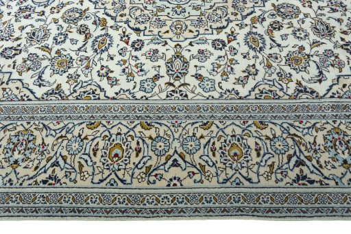 Corner detail of 2000s Kashan rug showing border pattern and Wool pile