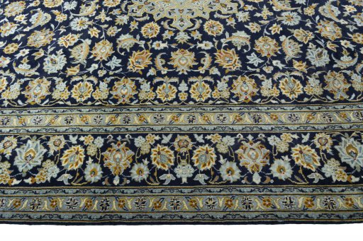 Corner detail of 1970s Kashan rug showing border pattern and Wool pile