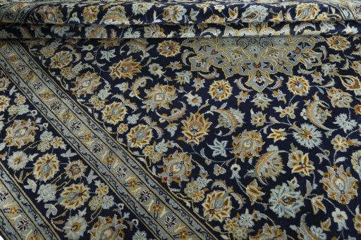 Close-up detail of 1970s Kashan rug from Iran / Persia showing Wool weave