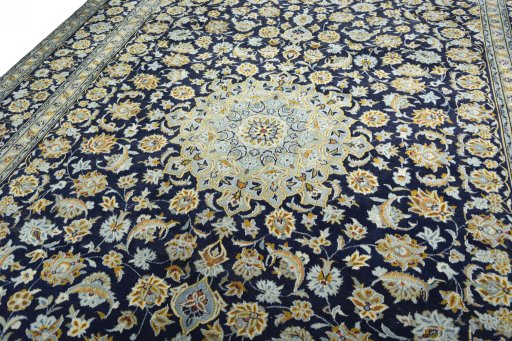 Backside of handmade 1970s Kashan rug showing knot structure and weave density