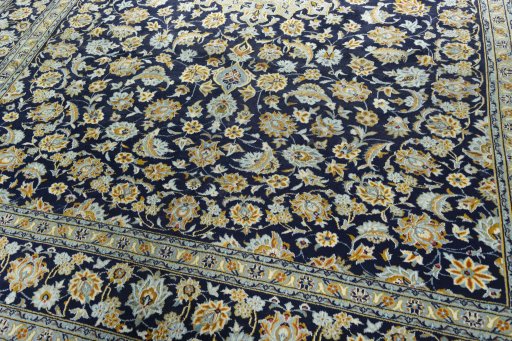 Close-up detail of 1970s Kashan rug from Iran / Persia showing Wool weave