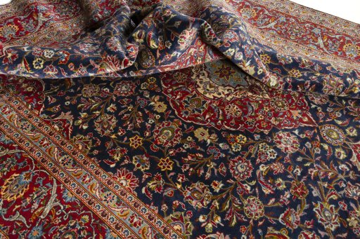 Surface texture of 2000s Kashan rug with natural Cork and intricate pattern