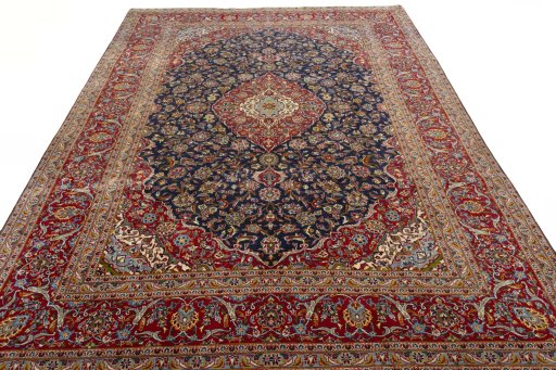 Surface texture of 2000s Kashan rug with natural Cork and intricate pattern