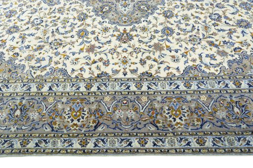 Corner detail of 2000s Kashan rug showing border pattern and Wool pile