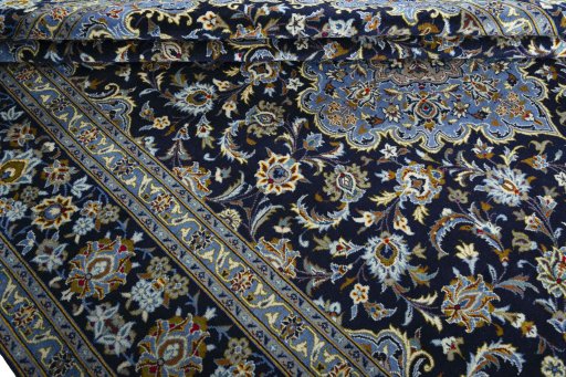 Close-up detail of 2000s Kashan rug from Iran / Persia showing Wool weave