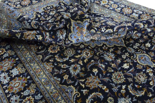 Surface texture of 2000s Kashan rug with natural Wool and intricate pattern