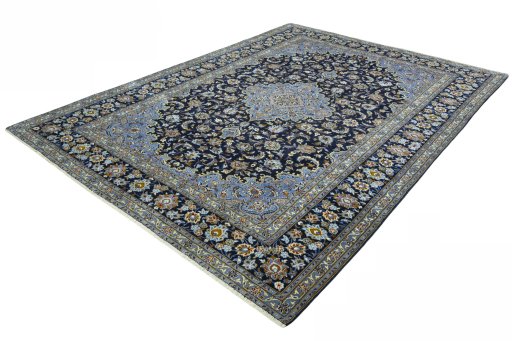 Corner detail of 2000s Kashan rug showing border pattern and Wool pile