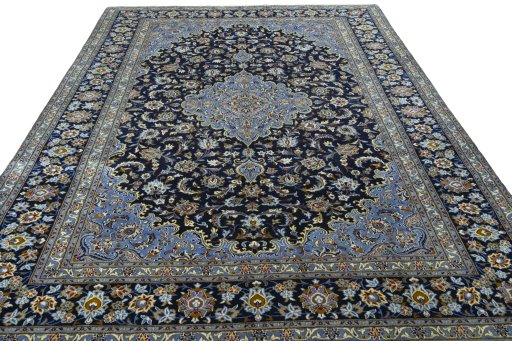 Surface texture of 2000s Kashan rug with natural Wool and intricate pattern