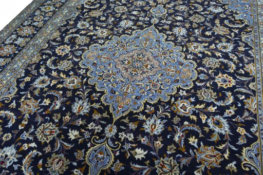 Backside of handmade 2000s Kashan rug showing knot structure and weave density