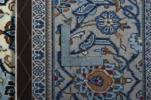 Backside of handmade 2000s Kashan rug showing knot structure and weave density