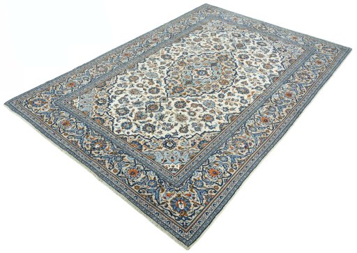 Corner detail of 2000s Kashan rug showing border pattern and Wool pile