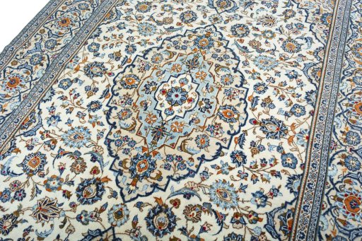 Backside of handmade 2000s Kashan rug showing knot structure and weave density