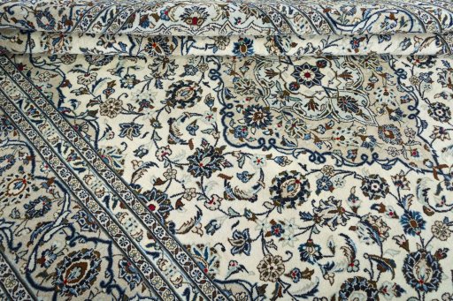 Close-up detail of 2000s Kashan rug from Iran / Persia showing Wool weave