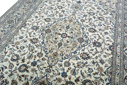 Backside of handmade 2000s Kashan rug showing knot structure and weave density