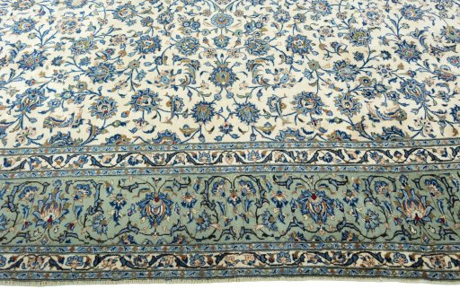 Corner detail of 2000s Kashan rug showing border pattern and Wool pile