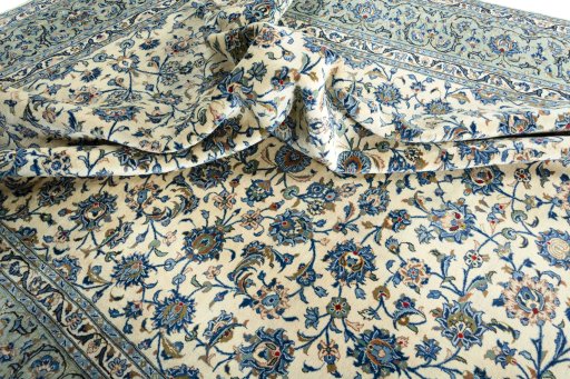 Surface texture of 2000s Kashan rug with natural Wool and intricate pattern