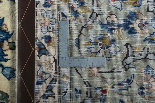 Backside of handmade 2000s Kashan rug showing knot structure and weave density