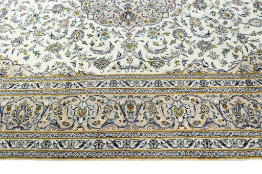Corner detail of 2000s Kashan rug showing border pattern and Wool pile