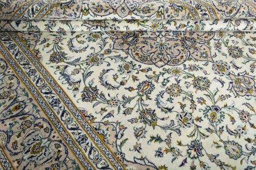 Close-up detail of 2000s Kashan rug from Iran / Persia showing Wool weave