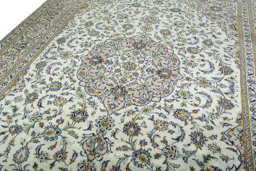 Backside of handmade 2000s Kashan rug showing knot structure and weave density
