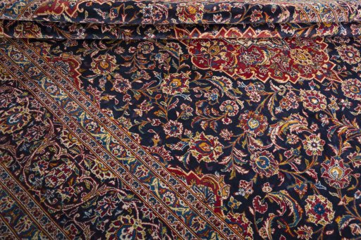 Close-up detail of 2000s Kashan rug from Iran / Persia showing Wool weave