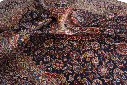 Surface texture of 2000s Kashan rug with natural Wool and intricate pattern