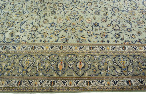 Corner detail of 2000s Kashan rug showing border pattern and Wool pile