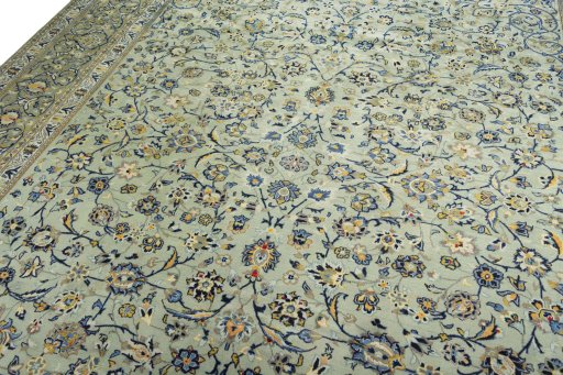 Backside of handmade 2000s Kashan rug showing knot structure and weave density