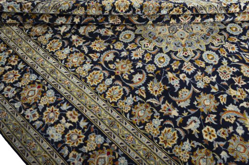 Close-up detail of 2000s Kashan rug from Iran / Persia showing Wool weave