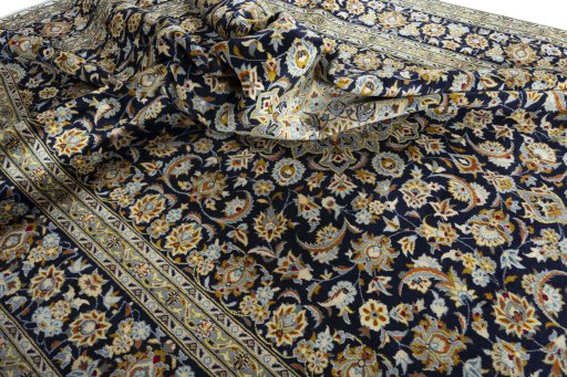 Surface texture of 2000s Kashan rug with natural Wool and intricate pattern