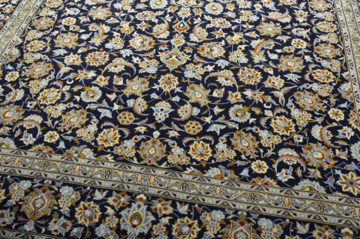 Close-up detail of 2000s Kashan rug from Iran / Persia showing Wool weave
