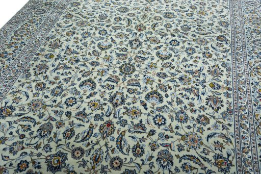 Backside of handmade 2000s Kashan rug showing knot structure and weave density