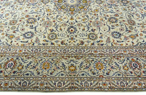 Corner detail of 2000s Kashan rug showing border pattern and Wool pile