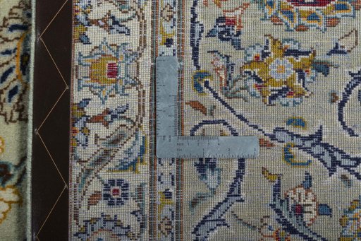 Backside of handmade 2000s Kashan rug showing knot structure and weave density