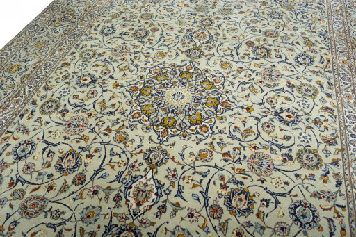 Backside of handmade 2000s Kashan rug showing knot structure and weave density