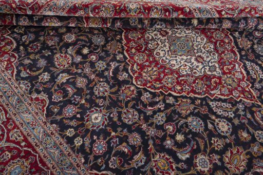 Close-up detail of 2000s Kashan rug from Iran / Persia showing Wool weave