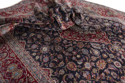 Surface texture of 2000s Kashan rug with natural Wool and intricate pattern