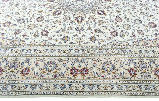 Corner detail of 2000s Kashan rug showing border pattern and Wool pile