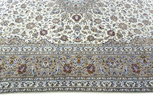 Corner detail of 2000s Kashan rug showing border pattern and Wool pile