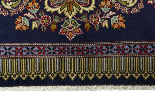 Backside of handmade New Kashan rug showing knot structure and weave density