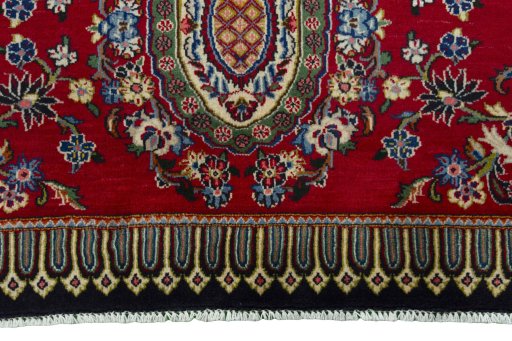 Backside of handmade New Kashan rug showing knot structure and weave density
