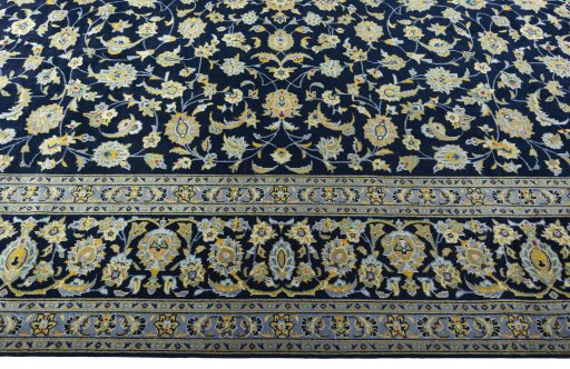 Corner detail of 1970s Kashan rug showing border pattern and Wool pile