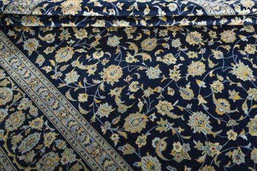 Close-up detail of 1970s Kashan rug from Iran / Persia showing Wool weave