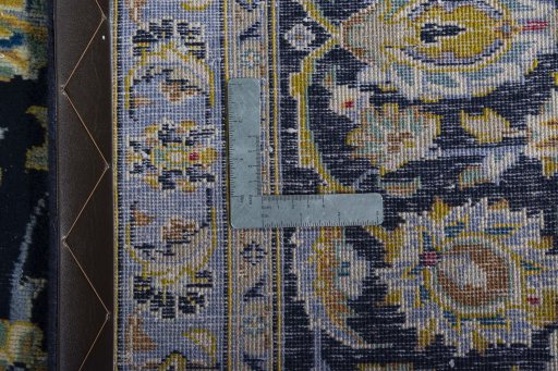 Close-up detail of 1970s Kashan rug from Iran / Persia showing Wool weave